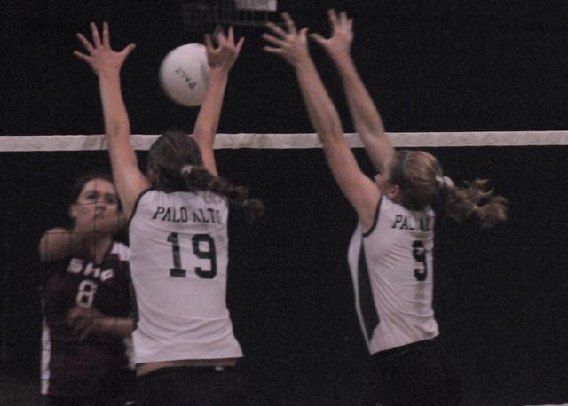 Melanie Wade (12) and Kimmy Whitson (12) go up for the block against Sacred Heart Prep. The Lady Vikes lost the first two sets and came back to win the next three. Photo Credit: Paige Borsos