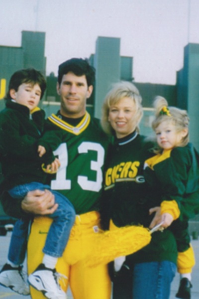 Tina and Steve Bono stand with their children Christoph (11) and Sophia (13) outside the Lambeau Arena in the team uniform. Steve played for the Green Bay Packers in 1997.