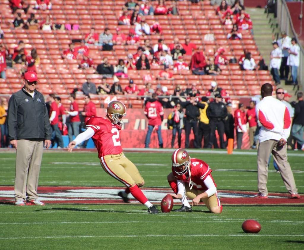 David Akers takes some practice field goals to warm up for todays game. Akers scored 12 points for the niners in todays game.