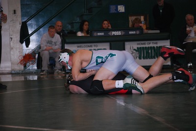 Erik Anderson (13) pins his opponent in a dual meet last year. Anderson will lead the team as well seasoned captain. 