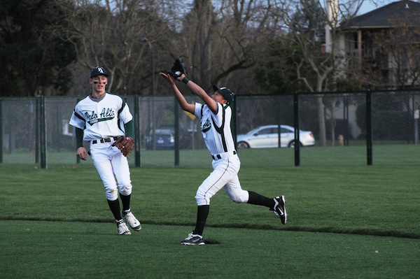 Paly third baseman Alec Wong (12) goes in for the catch on the Paly baseball field. He joined the varsity baseball team his sophomore year, and has also played varsity basketball for three years. 