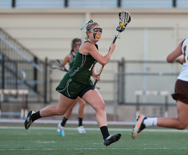 Kimmie Flather (12) drives up the field. Photo by Grant Shorin 
