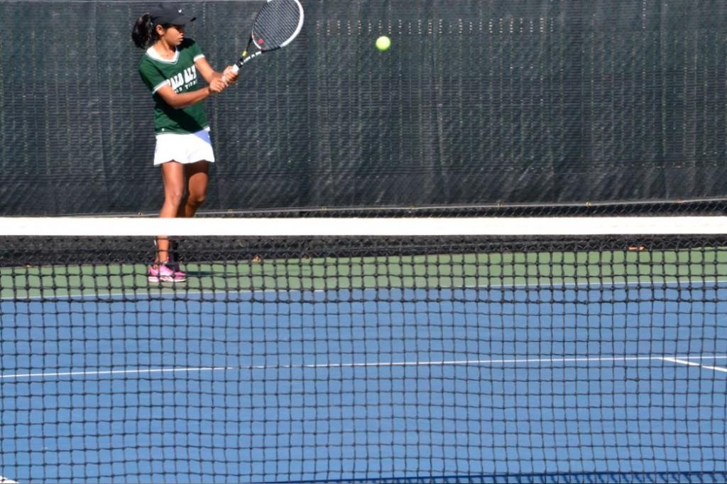 Number 1 single Aashli Budhiraja (14) returns a serve from Lynbrooks number 1 single in the second session of competition. Budhiraja continued her wins all throughout the tournament, winning all of her sets.