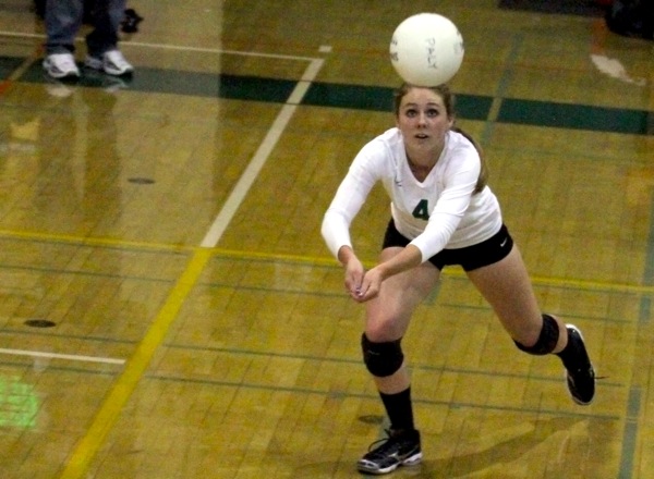 Shelby Knowles (13) digs for the ball in the second set of the game. 