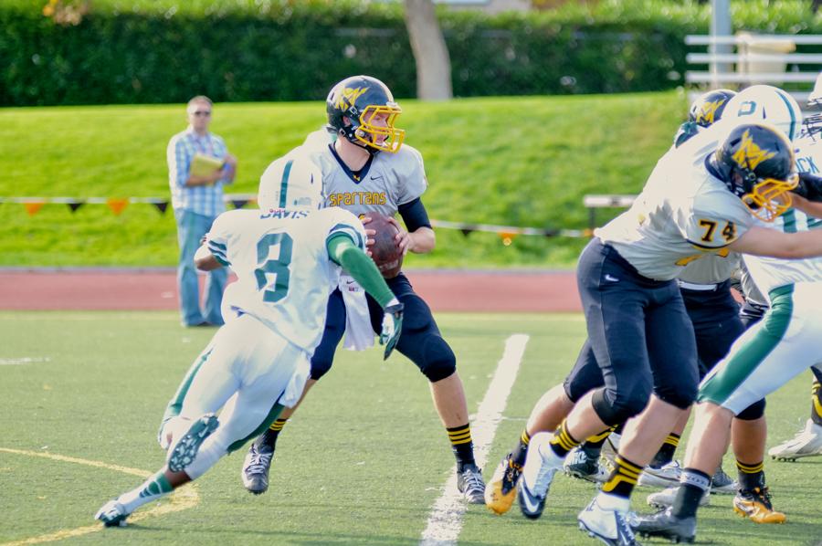 Malcom Davis (14) hunts down the Spartans quarterback, in a stout performace by the Paly defense. Paly prevailed, 56-28. 