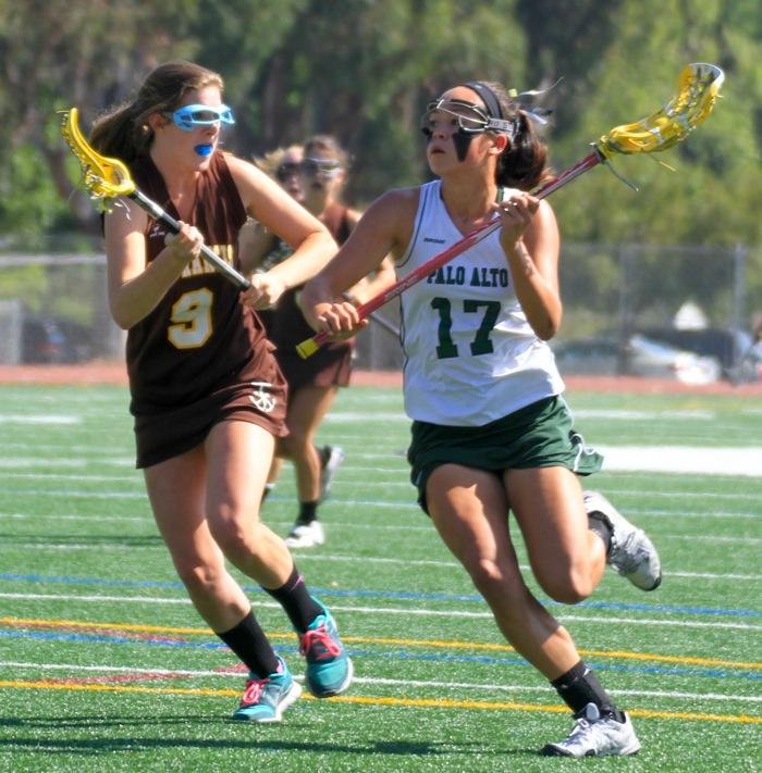 Nina Kelty (13) drives towards the net for Paly. Kelty had four goals in the Vikings 16-15 loss to St. Francis High School.