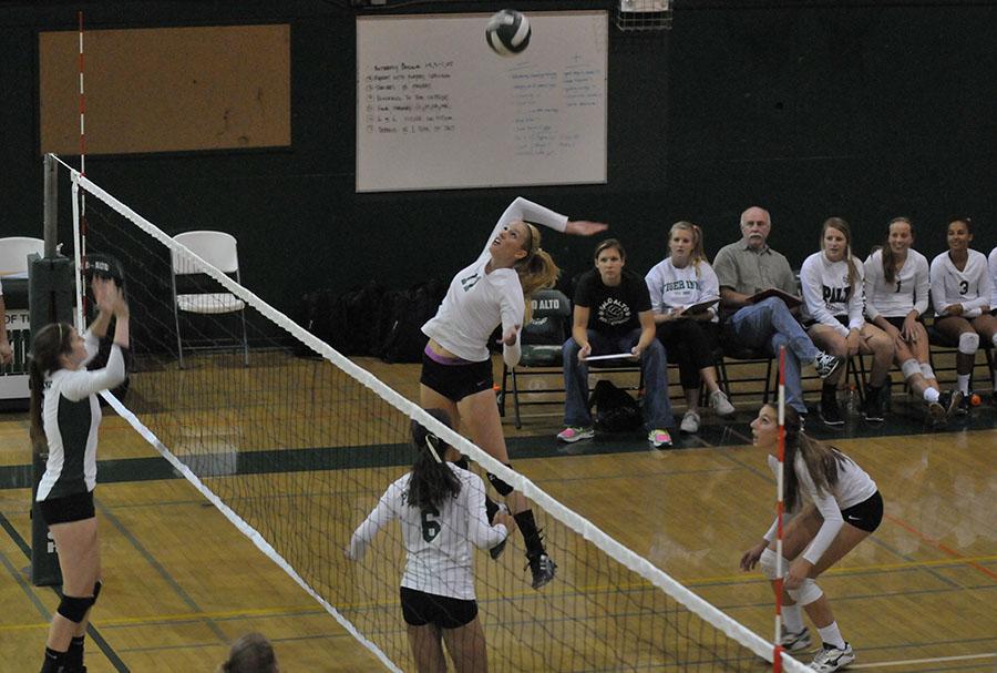 Lauren Kerr (14) leaps up to strike a kill on Thursday night. The Lady Vikes went on to lose the back-and-fourth battle to the Homestead Mustangs.