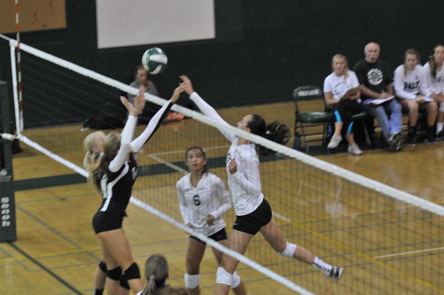 Claire Dennis (16) jumps for a hit against Los Gatos. The Vikings went on to win 3-2 in their first league game.