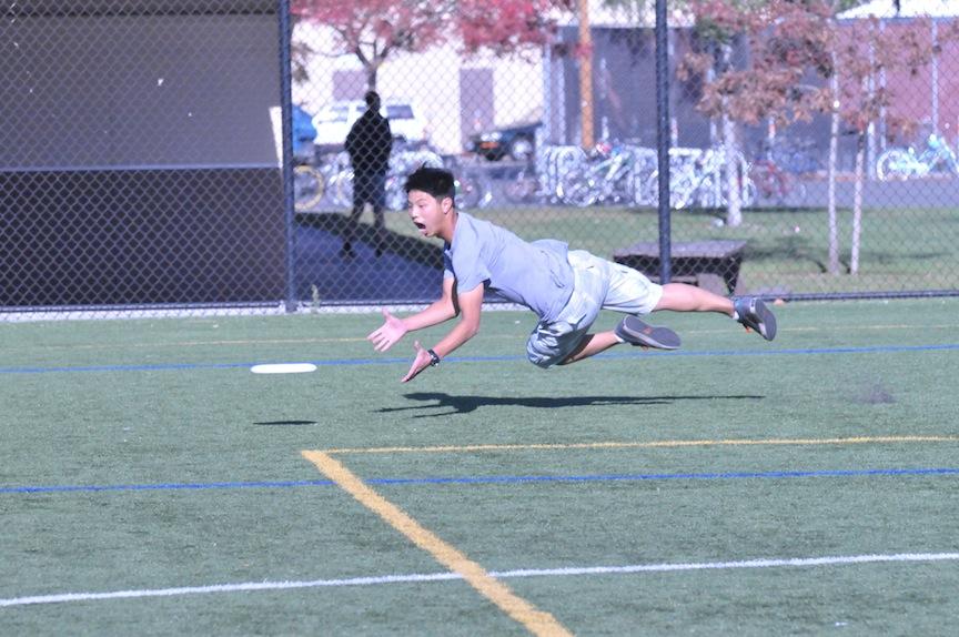 Jeremy Dao (‘14) dives for a Frisbee™ at the Paly Ultimate Club practice on the soccer field. The Ultimate team has to fight for their field space, as the Paly varsity sports are favored for field reservation.  