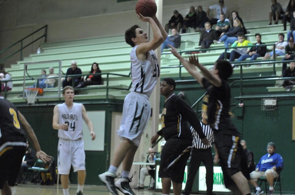 Kevin Mullin (15) puts up a shot. Mullin contributed 28 points to the Vikings 47-35 defeat of the Mountain View Spartans.