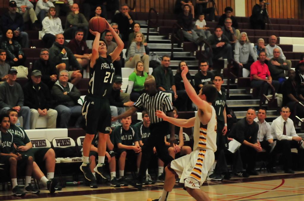 Kevin Mullen (15) drains a 3 points shot from the corner during the 4th quarter. Mullen finished the game with 20 points.