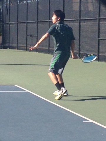 George He (14) receives a serve during his match.  Paly went on to win 5-2.