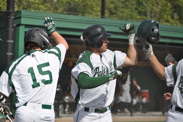 Jack Cleasby (14) celebrates after hitting a home run in the first inning. The Vikings would go on to win 6-2.