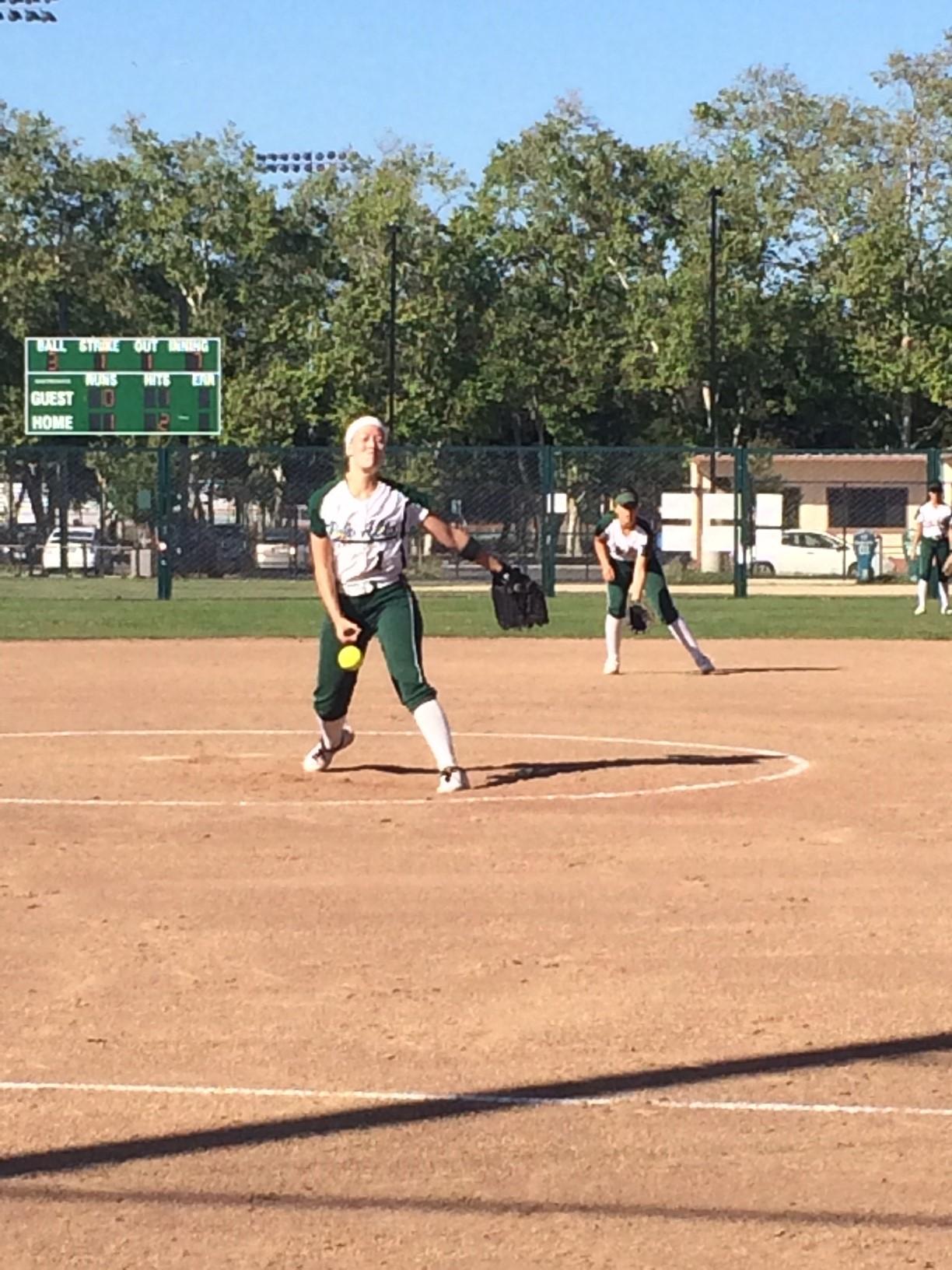 Julia+Saul+%2814%29+throws+a+pitch+in+the+seventh+inning.+She+had+10+strikeouts+in+the+game.