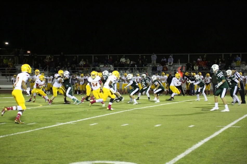 The+Palma+quarterback+steps+back+to+pass+as+the+Paly+defense+plays+coverage.+The+Vikings+ended+up+falling+35-7+to+the+Chieftains.