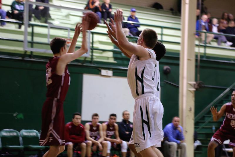 Oliver Svirsky (16) jumps up to block an opponents pass. The Vikings went on to dominate over the Eagles 58-44.