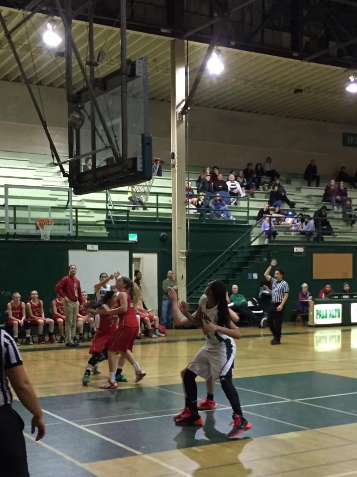 Alexis Harris ('17) boxes out a Saratoga defender in hopes of an offensive rebound. Harris had 11 points, three boards, and five blocks in the game.
