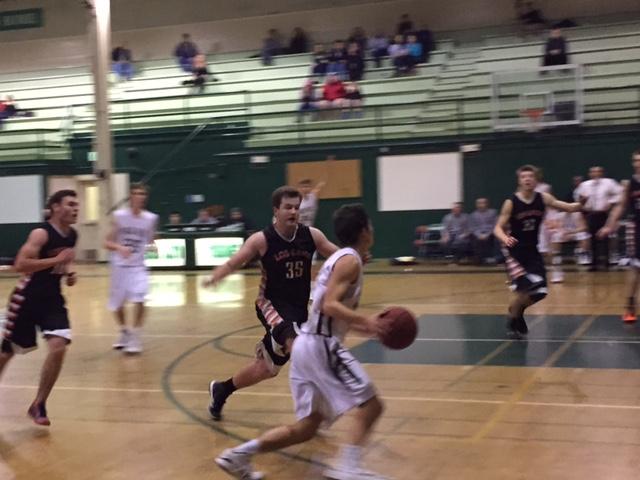 Kevin Mullin (`15) drives towards the rim during the fourth quarter of Palys loss to Los Gatos.
