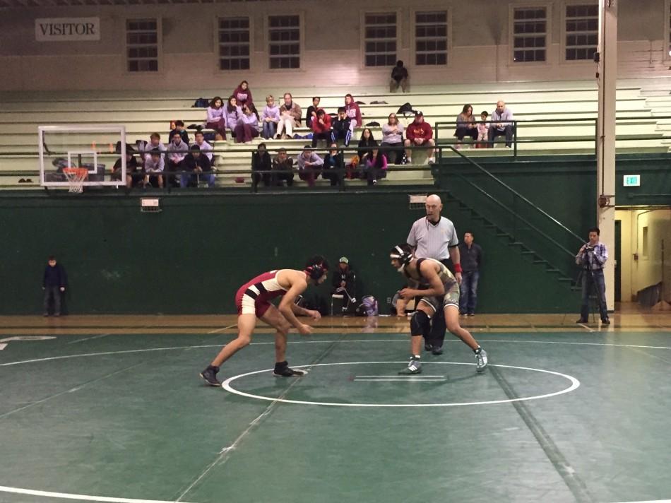 Seth Goyal (17) looks to take down his opponent in the dual meet against Cupertino on Jan. 22.