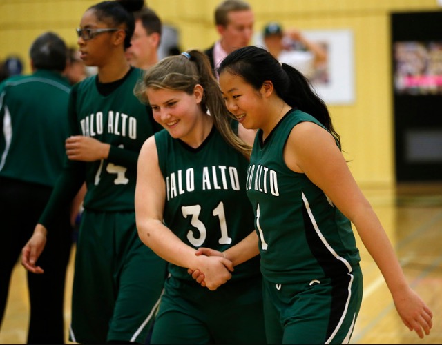 Sophie Frick (18) and Carly Leong (18) celebrate after sealing the girls basketball league championship. Frick has been chosen as Palys female underclassman of the year.