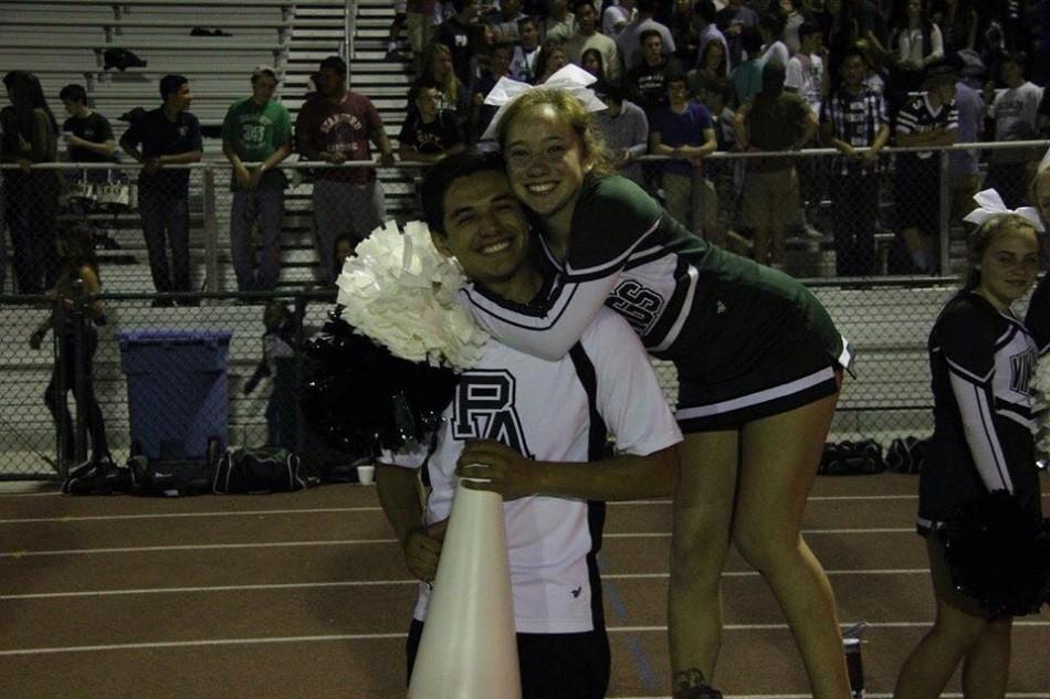 Alfredo Gonzalez ('16) and Ella Higashi ('16) pose on the sideline during one of the Paly football games. 