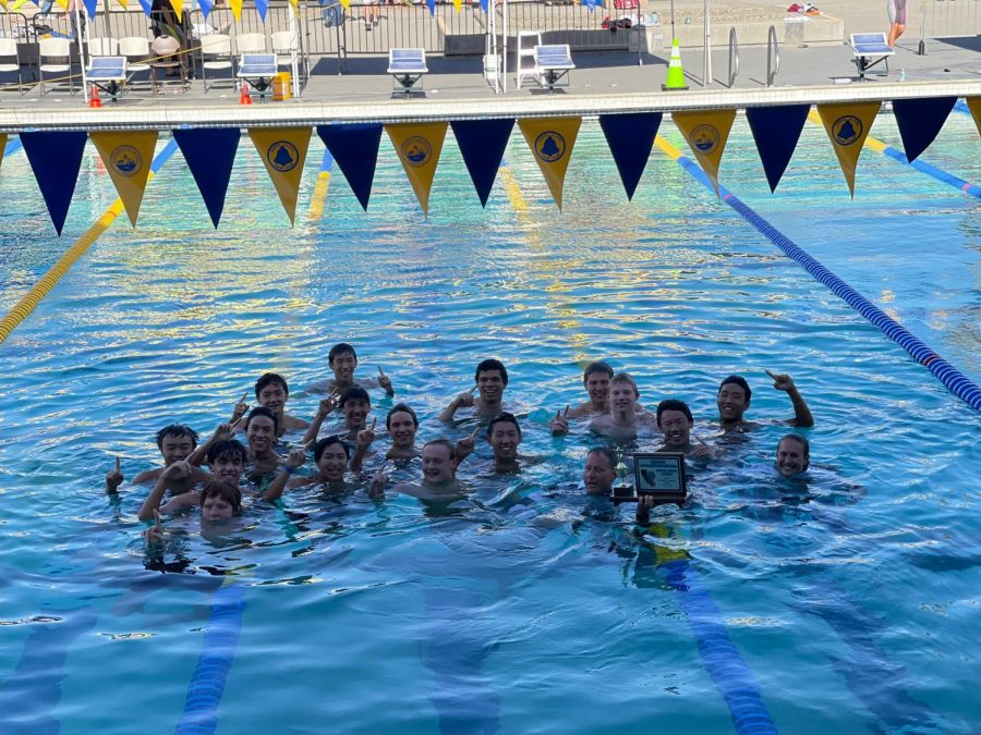 The+boys+celebrate+their+CCS+victory+in+the+pool+along+with+head+coach+Danny+Dye.+