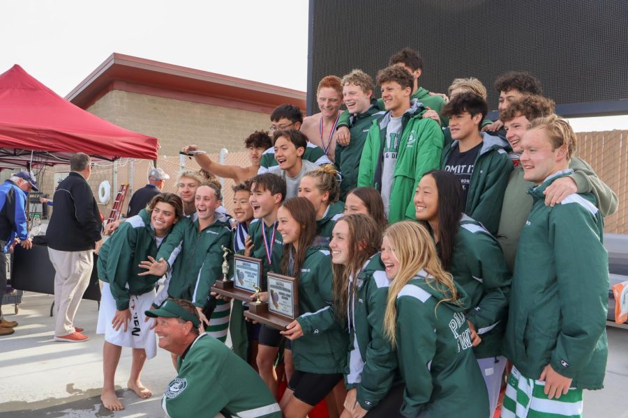 Both swim teams celebrate their respective finishes. Photo by Caleb Wong