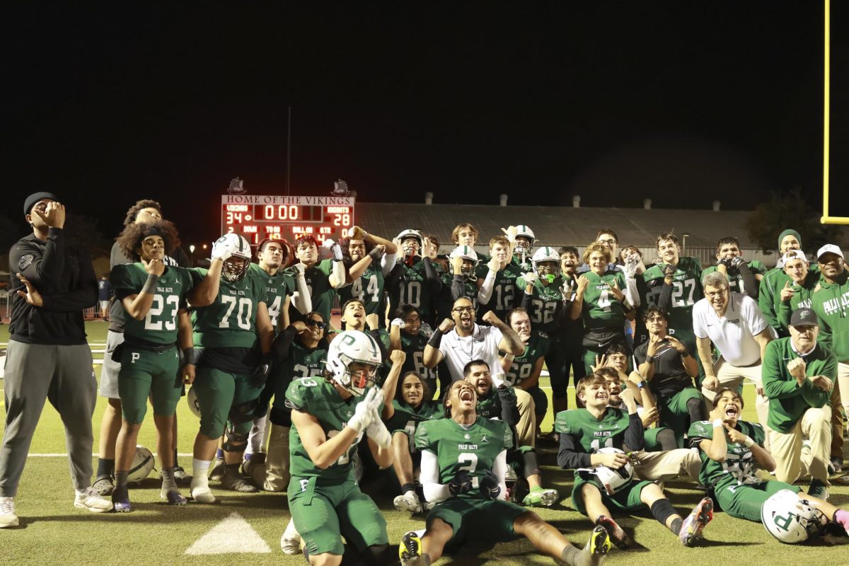 The Paly Football team poses for a group picture after a close win against Kings Academy