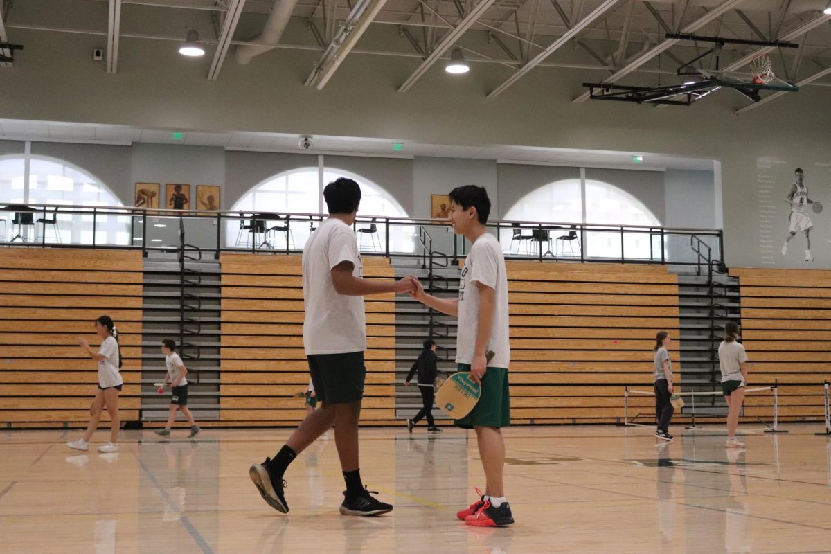 Sophomore Paly students celebrate after scoring a point in pickle ball. 